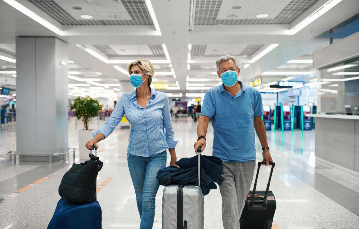 Couple walking through airport