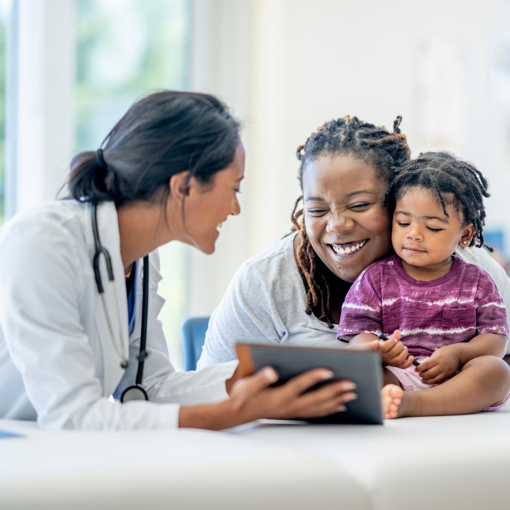 A mother and her young son visit the doctor