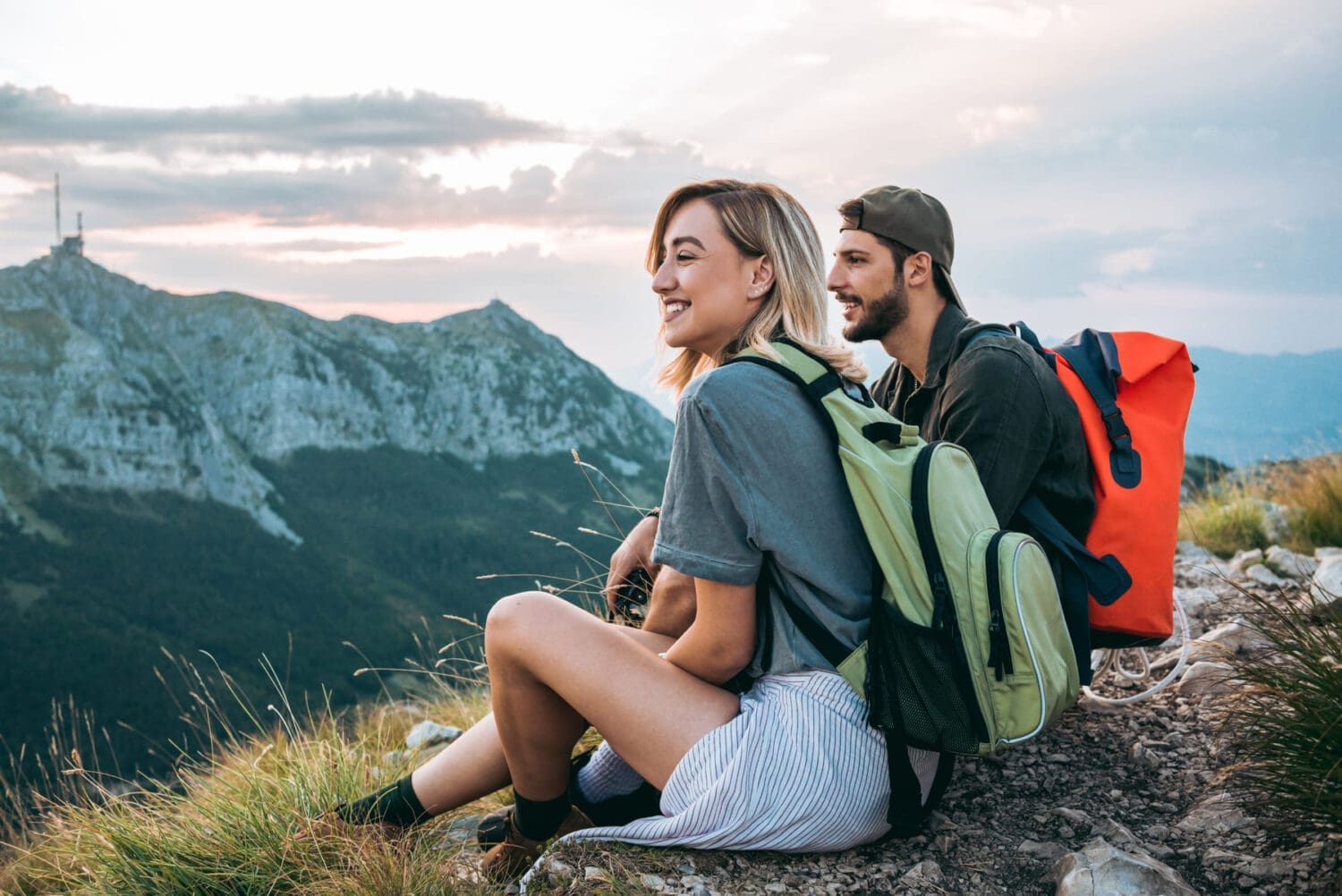 young couple of hikers enjoying the beautiful nature from high above - Where Are The Cheapest Places To Live In And Relocate To In 2022 - William Russell Expat Insurance Blog
