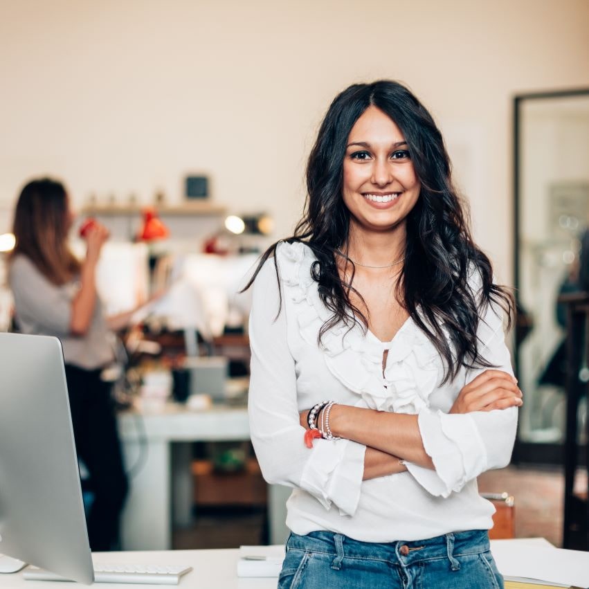 William Russell Blog - Female empowerment banner - confident woman in office with arms crossed